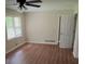 Bright bedroom showcasing wood flooring, a ceiling fan and plenty of natural light at 5924 Central Church Rd, Douglasville, GA 30135