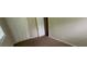 Bedroom featuring carpet flooring, and a closet with folding doors for storage at 5924 Central Church Rd, Douglasville, GA 30135
