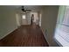 A combined living and dining area boasting wood flooring and large windows at 5924 Central Church Rd, Douglasville, GA 30135