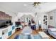 Spacious bedroom with a vaulted ceiling, a ceiling fan and hardwood floors at 10400 Groomsbridge Rd, Alpharetta, GA 30022