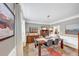 Dining room with a wooden table and stylish chairs, complemented by elegant decor and hardwood floors at 10400 Groomsbridge Rd, Alpharetta, GA 30022