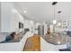Well-equipped kitchen featuring stainless steel appliances, granite counters, and ample cabinet space at 10400 Groomsbridge Rd, Alpharetta, GA 30022
