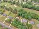 An aerial view shows the golf course community, houses, and green landscape at 1585 Lake Dow Rd, Mcdonough, GA 30252