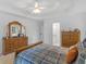 Bedroom featuring a wood bed, dresser, and view from the window at 1585 Lake Dow Rd, Mcdonough, GA 30252