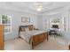 Bright bedroom featuring ample natural light, ceiling fan and workspace at 1585 Lake Dow Rd, Mcdonough, GA 30252