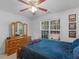 Comfortable bedroom features a ceiling fan, natural light, and decor at 1585 Lake Dow Rd, Mcdonough, GA 30252