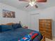 Comfortable bedroom features a ceiling fan, natural light, and decor at 1585 Lake Dow Rd, Mcdonough, GA 30252