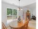 Bright breakfast nook featuring a large window and a view of the backyard at 1585 Lake Dow Rd, Mcdonough, GA 30252