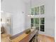 Bright dining room with high ceilings, large windows, and view into the foyer at 1585 Lake Dow Rd, Mcdonough, GA 30252