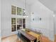 Bright dining room with high ceilings, large windows, and a farmhouse-style table at 1585 Lake Dow Rd, Mcdonough, GA 30252