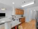 Stylish kitchenette with granite countertops, stainless steel appliances, and wood cabinets at 1585 Lake Dow Rd, Mcdonough, GA 30252