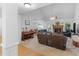 Spacious living room featuring a fireplace, comfortable seating, and hardwood floors at 1585 Lake Dow Rd, Mcdonough, GA 30252