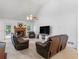 Bright living room with a fireplace, vaulted ceilings, and comfortable seating at 1585 Lake Dow Rd, Mcdonough, GA 30252