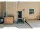 The back deck of this home shows a door leading inside, a small window and wood siding at 2012 Variations Ne Dr, Atlanta, GA 30329