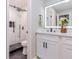 Bathroom view with subway tile shower, modern vanity, and illuminated mirror at 2012 Variations Ne Dr, Atlanta, GA 30329