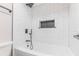 Bright white bathroom featuring a tiled shower and bathtub at 2012 Variations Ne Dr, Atlanta, GA 30329