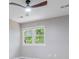 This bedroom features a modern ceiling fan, large window and neutral paint at 2012 Variations Ne Dr, Atlanta, GA 30329
