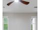 Bright bedroom featuring a ceiling fan and natural light from two windows at 2012 Variations Ne Dr, Atlanta, GA 30329