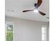 Bright bedroom featuring a ceiling fan and natural light from two windows at 2012 Variations Ne Dr, Atlanta, GA 30329