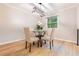 Cozy dining area with a glass-top table, upholstered chairs, and modern chandelier at 2012 Variations Ne Dr, Atlanta, GA 30329