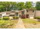 Charming townhome with manicured front lawn, beautiful landscaping, and private entrance at 2012 Variations Ne Dr, Atlanta, GA 30329