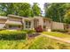 Charming townhome with manicured front lawn, beautiful landscaping, and private entrance at 2012 Variations Ne Dr, Atlanta, GA 30329