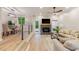 Bright living space with hardwood floors, fireplace, and an open floor plan to a dining area at 2012 Variations Ne Dr, Atlanta, GA 30329