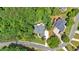 Aerial view of neighborhood featuring lush green landscaping and well-maintained homes at 1311 Cobblemill Nw Way, Kennesaw, GA 30152