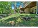 Spacious backyard with a wooden fence, mature trees, and multi-level decks providing a tranquil retreat at 1311 Cobblemill Nw Way, Kennesaw, GA 30152