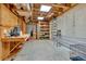 Unfinished basement with exposed ceiling, workbench, shelving, and storage potential at 1311 Cobblemill Nw Way, Kennesaw, GA 30152