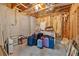 Unfinished basement showing storage potential with stacked luggage and household items at 1311 Cobblemill Nw Way, Kennesaw, GA 30152