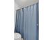 Bathroom featuring a blue shower curtain and white toilet at 1311 Cobblemill Nw Way, Kennesaw, GA 30152