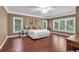 Bright bedroom featuring hardwood floors and large windows at 1311 Cobblemill Nw Way, Kennesaw, GA 30152