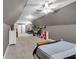 Bonus room features a bed, desk, shelving, and neutral carpet, ideal for various activities at 1311 Cobblemill Nw Way, Kennesaw, GA 30152
