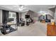 Large bonus room with multiple desks, a media area, and natural light; perfect for entertainment and relaxation at 1311 Cobblemill Nw Way, Kennesaw, GA 30152