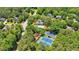 Aerial view of community pool and tennis courts surrounded by mature trees at 1311 Cobblemill Nw Way, Kennesaw, GA 30152