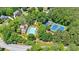 Aerial view of neighborhood community pool and tennis courts in a lush setting at 1311 Cobblemill Nw Way, Kennesaw, GA 30152