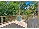 Spacious wooden deck overlooking a lush backyard, providing a great outdoor living area at 1311 Cobblemill Nw Way, Kennesaw, GA 30152