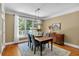 Charming dining room with hardwood floors, natural light, and an elegant chandelier fixture at 1311 Cobblemill Nw Way, Kennesaw, GA 30152