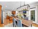 Stylish dining area adjacent to kitchen, featuring hardwood floors, modern lighting, and outdoor access at 1311 Cobblemill Nw Way, Kennesaw, GA 30152
