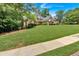 A two-story brick home and manicured front lawn create classic curb appeal at 1311 Cobblemill Nw Way, Kennesaw, GA 30152
