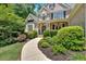 Well landscaped and maintained front yard showing walkway to home entrance at 1311 Cobblemill Nw Way, Kennesaw, GA 30152