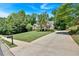 Two-story brick home with landscaped front yard, concrete driveway, and mailbox at 1311 Cobblemill Nw Way, Kennesaw, GA 30152