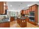 A full kitchen with stainless steel appliances and a central island at 1311 Cobblemill Nw Way, Kennesaw, GA 30152
