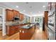 A spacious kitchen with stainless steel appliances, granite counters, and a center island at 1311 Cobblemill Nw Way, Kennesaw, GA 30152