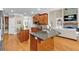 A kitchen with wood cabinets, granite countertops, and stainless steel appliances at 1311 Cobblemill Nw Way, Kennesaw, GA 30152