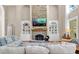 Cozy living room with stone fireplace and built-in shelving provides a relaxing atmosphere at 1311 Cobblemill Nw Way, Kennesaw, GA 30152