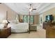 Bright main bedroom with a four-poster bed, sitting area, and large windows; offering a serene retreat at 1311 Cobblemill Nw Way, Kennesaw, GA 30152