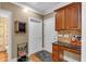 Mudroom with built-in desk, storage cabinets, and convenient access to garage at 1311 Cobblemill Nw Way, Kennesaw, GA 30152