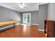 Spacious room featuring wood floors, French doors, and a wooden table at 1311 Cobblemill Nw Way, Kennesaw, GA 30152